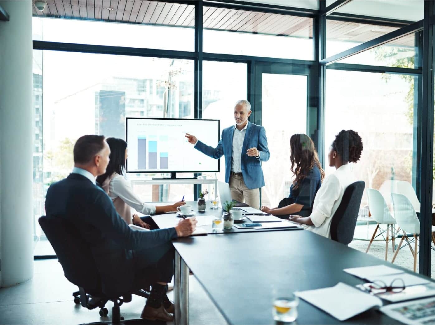 Client team receiving IT partner presentation on consulting solutions. 