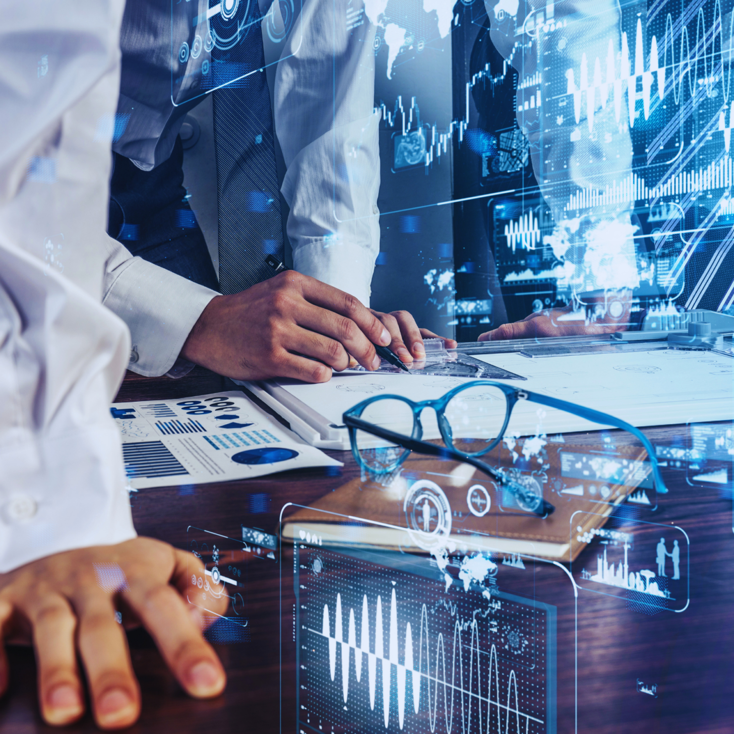 Close-up of professionals analyzing engineering documents with digital data overlay.