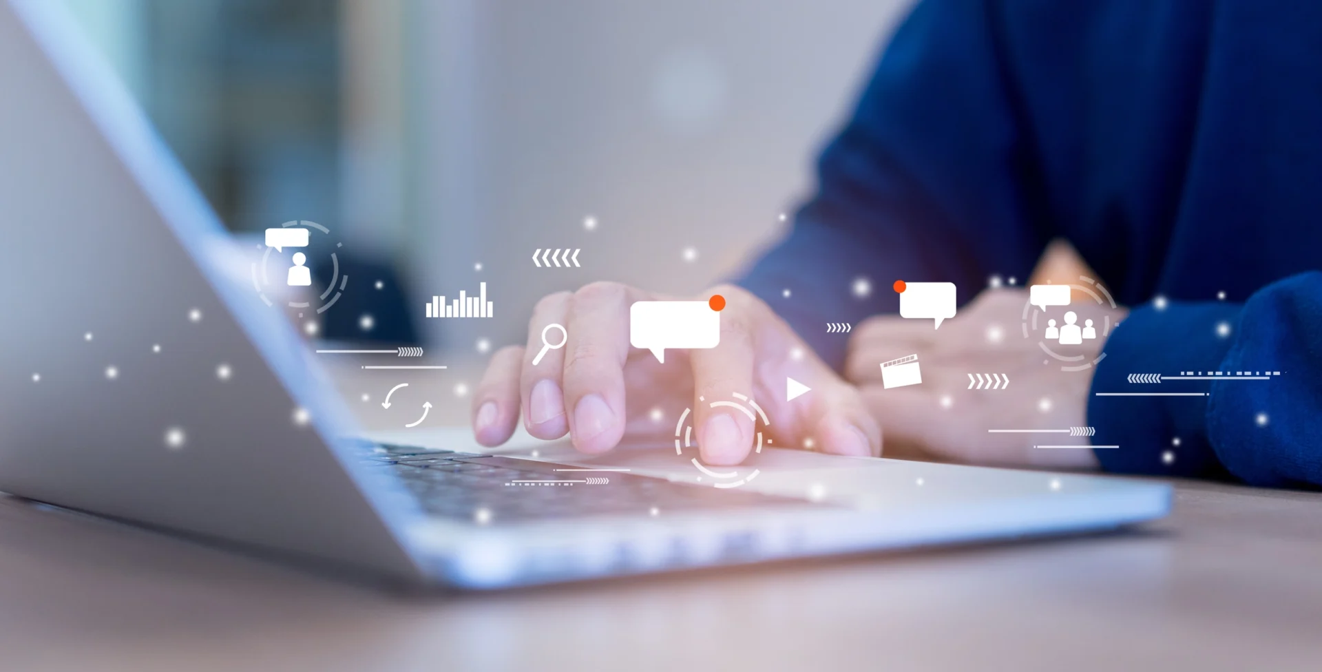 Close-up of a person typing on a laptop with digital collaboration and cloud computing icons overlaid.