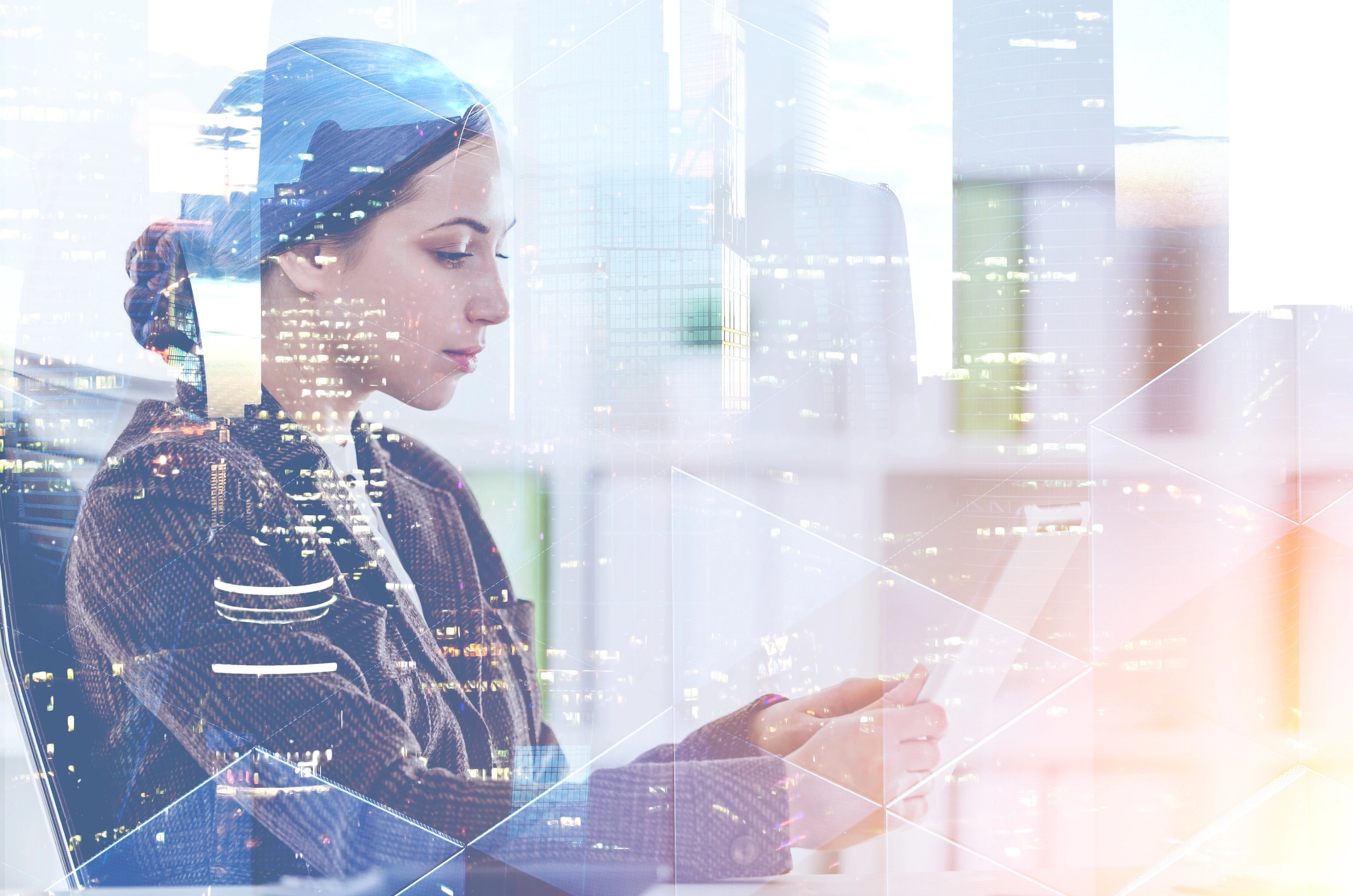 Female cybersecurity analyst using a tablet in a digital environment.