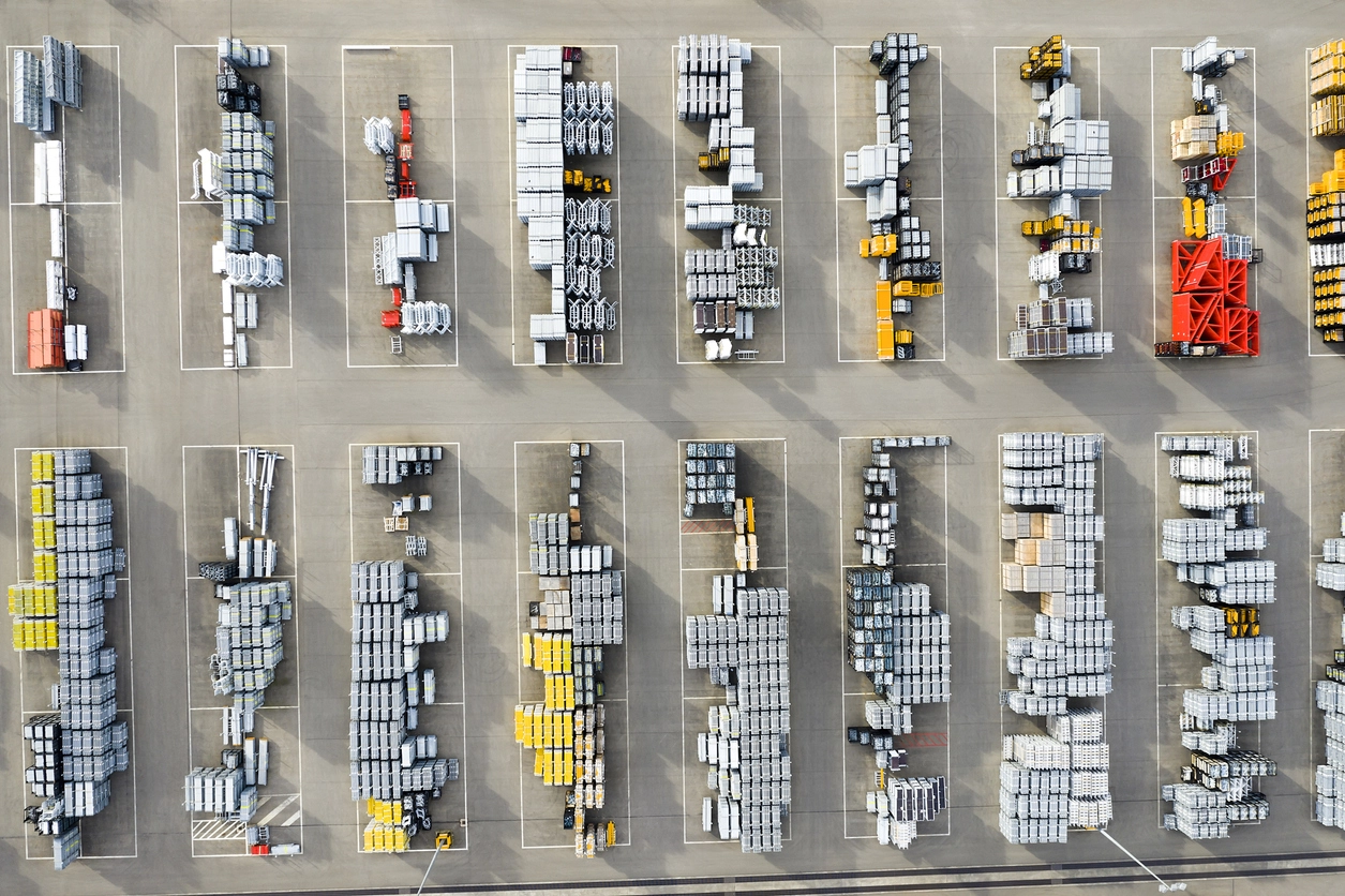 Aerial view of an organized industrial storage yard.