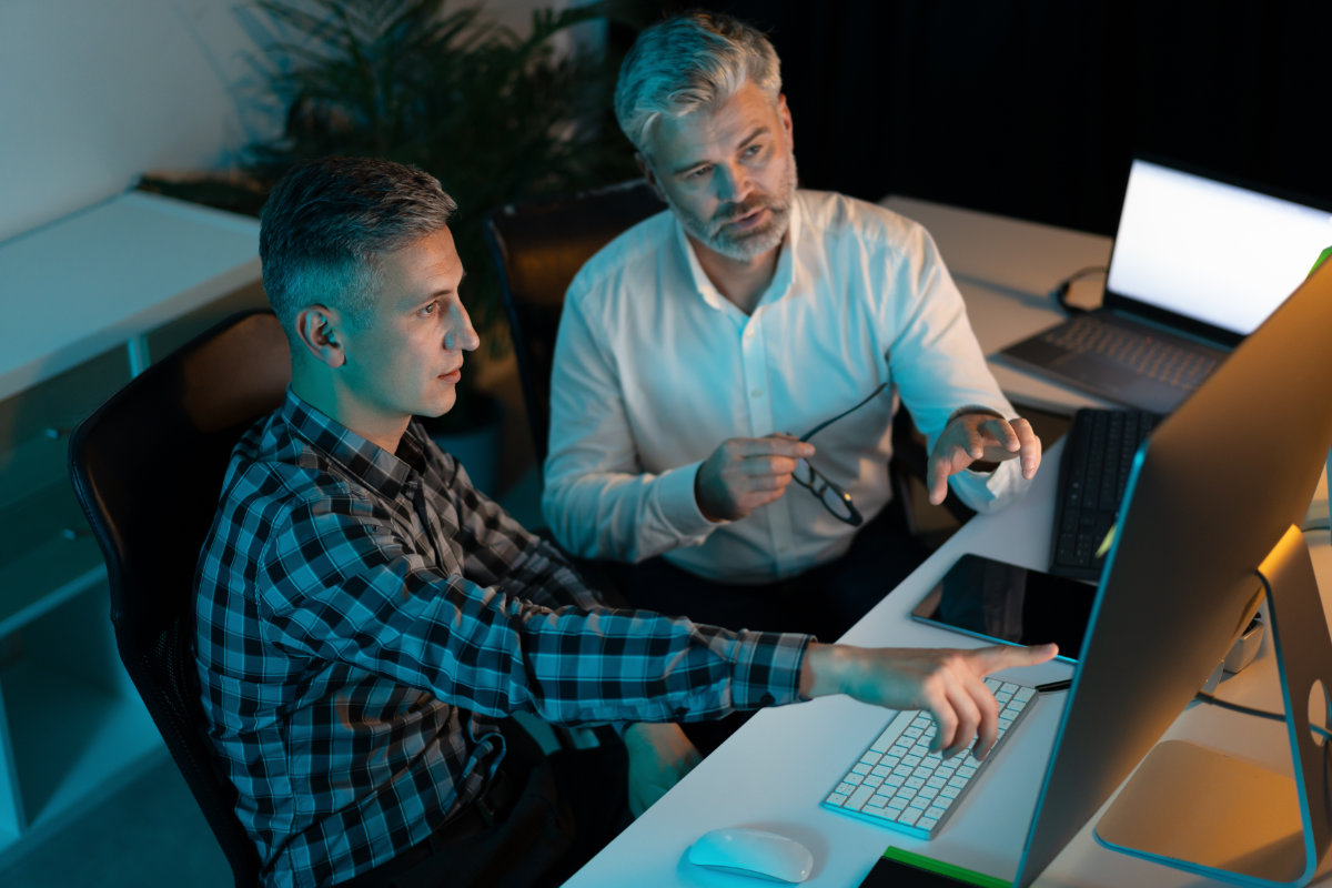 Cybersecurity consultants collaborating on incident response and enterprise security strategy.