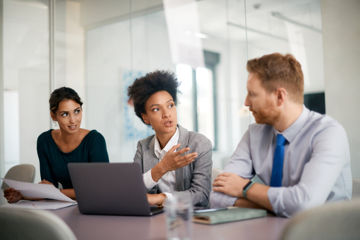 Cybersecurity team discussing Qualys implementation and vulnerability management strategy.