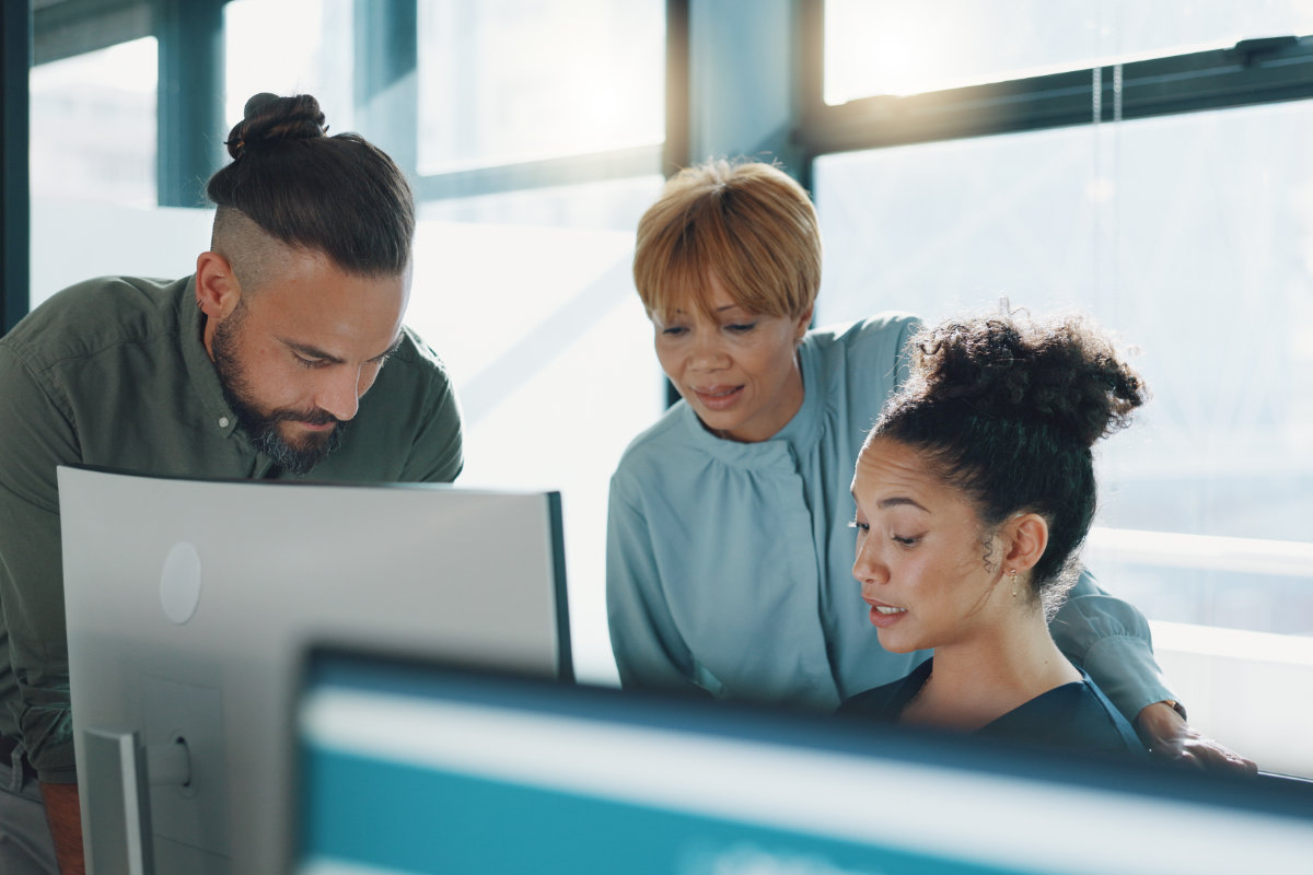 Security team collaborating on risk analysis and remediation within a managed risk operations center.